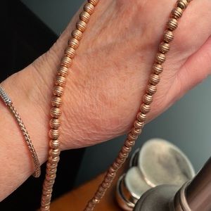 18” adjusts to 23.5” diamond cut bead necklace, rose gold tone.